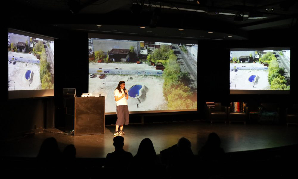 Female presenter on stage